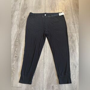 Stars above woman’s ribbed  knit pajama pants